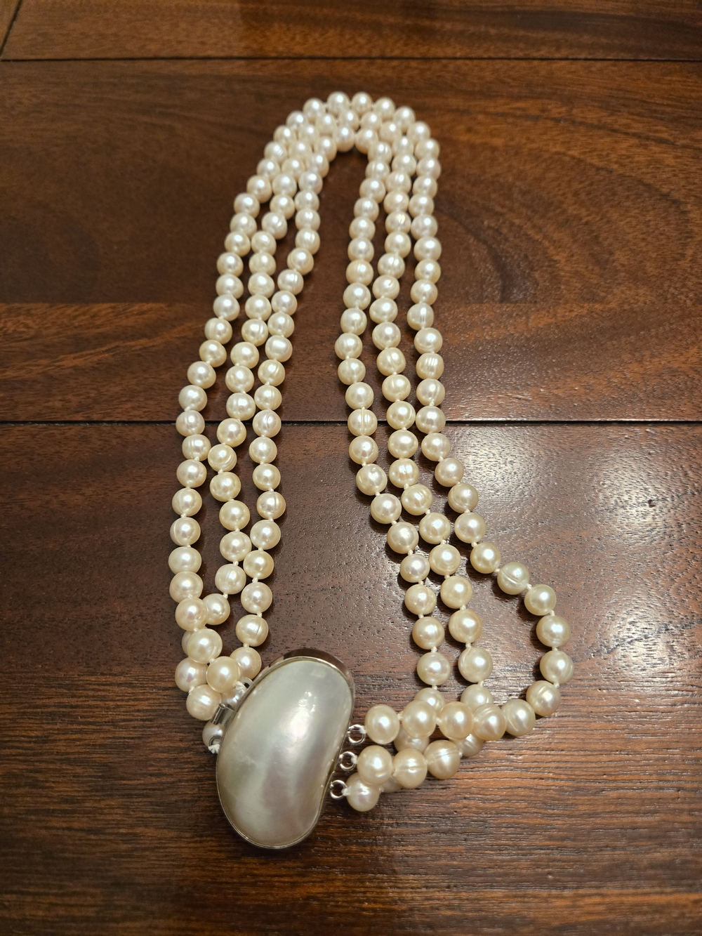 Three-Strand Cream Pearl Necklace with Mother-of-Pearl Clasp